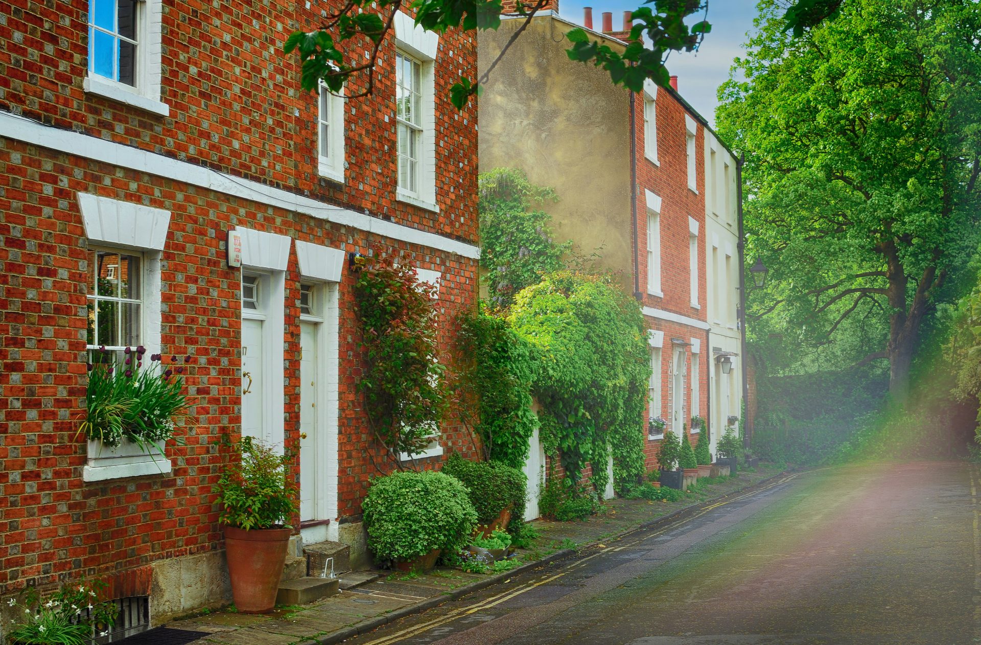 white and brown brick house near road during daytime